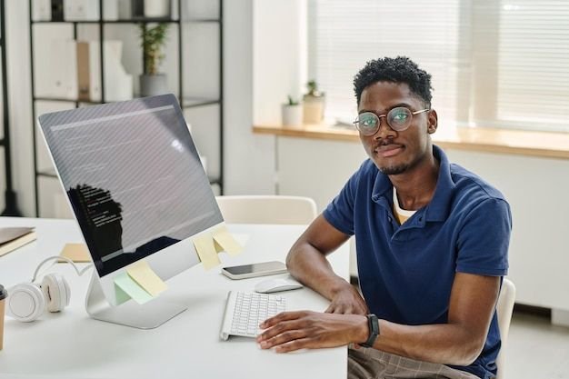 young developer working at his workplace with computer premium photo